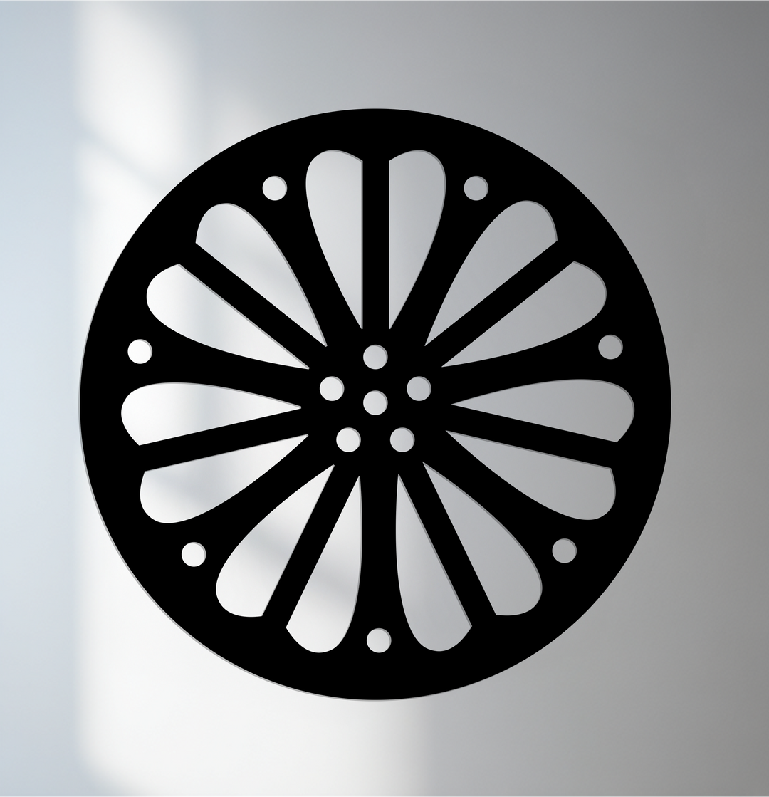 Negative space highlights a radiating petal pattern creating a striking decoration wall art piece in this round black metal wall art.