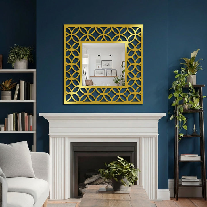 Gold dominates this interlocking circle pattern square framed wall mirror featuring an elegant geometric frame over a white fireplace.