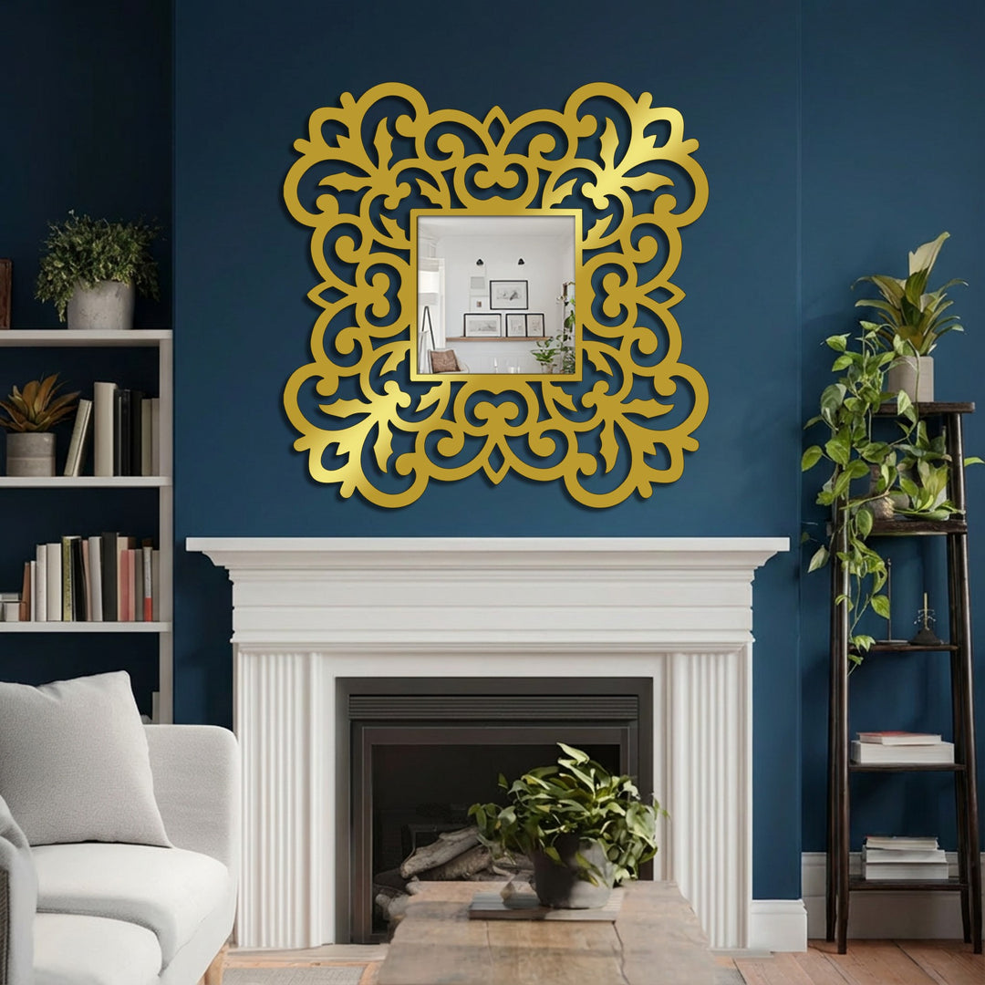 Gold-toned finish highlights the ornate floral scrollwork of this square decorative mirror, lending a luxurious touch to its metal frame detail.