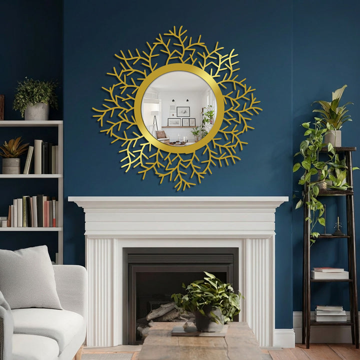 Against a striking navy wall, a white mantel and built-in bookcase complement the round botanical modern mirror with a golden leaf frame.