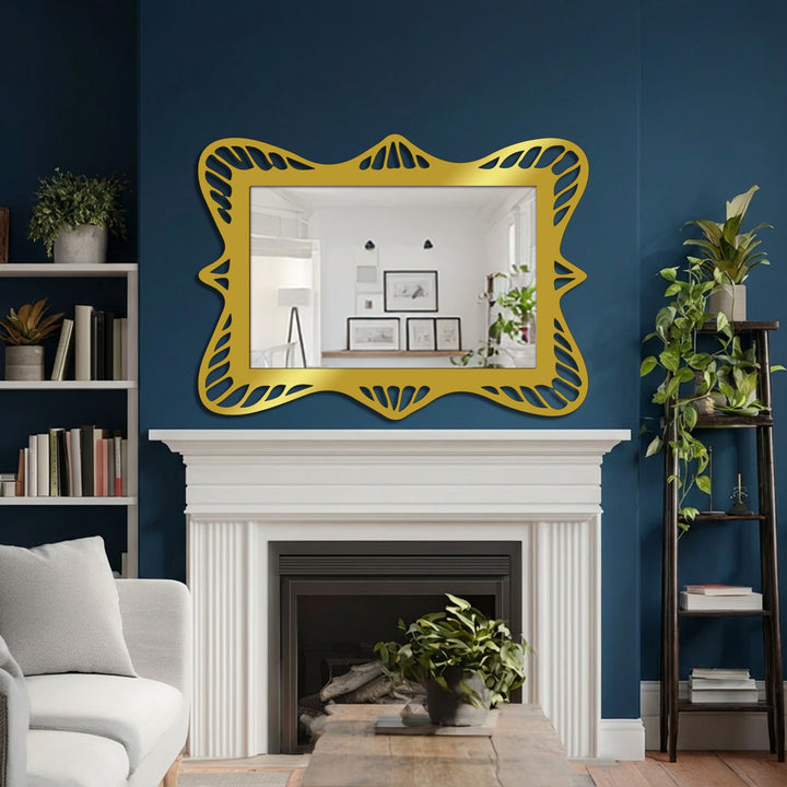 Elaborate gold frame on this mirror for wall decor features a repeating openwork leaf pattern bordering the rectangular reflective surface.