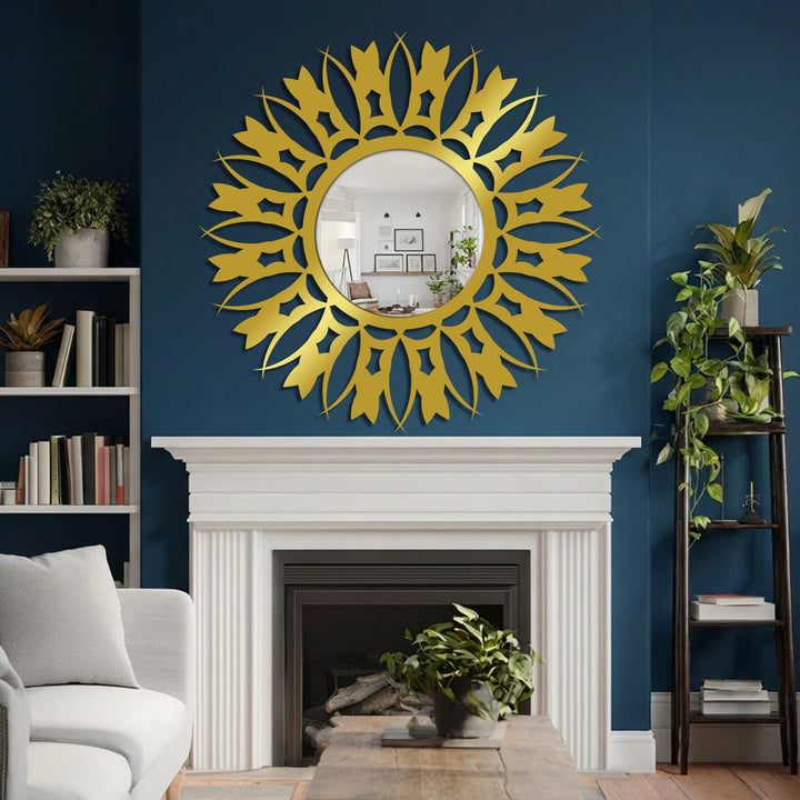 The polished golden finish of this large floral sunburst modern wall mirror beautifully reflects light against the deep blue wall.