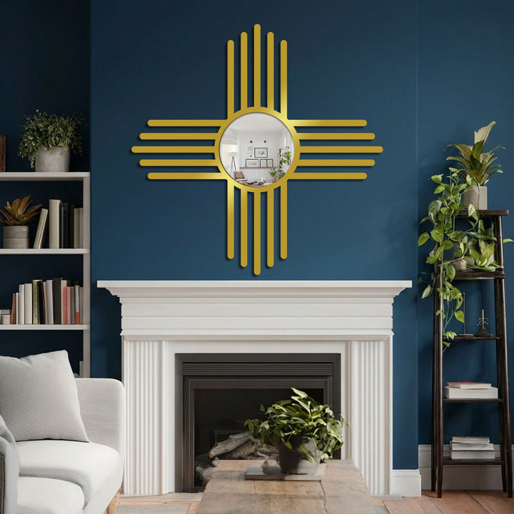 Strong color contrast defines this interior scene, where a gold-toned bathroom mirror accentuates the deep blue wall above a white fireplace.