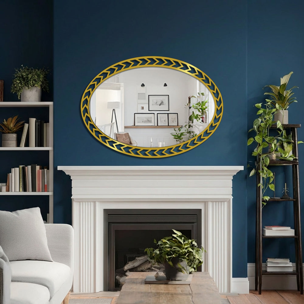 Neutral color temperature reflects from the Geometric Chevron Edge Oval framed wall mirror, hung above a fireplace, offering bright contrast to the navy wall.