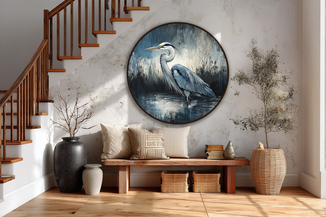 Horizontal, round oil painting art piece titled 'Silent Waters – Elegant Heron,' showcasing a wildlife painting of a heron wading in water.