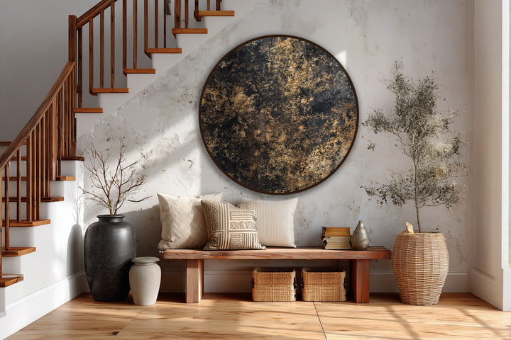 Swirling textures in this round, black and gold painting evoke a sense of dynamic movement, an elegant example of abstract oil painting decoration.