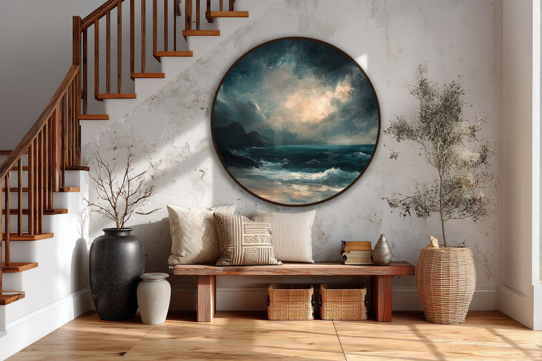 Dramatic color transition defines the 'Tempest Horizon' round oil painting artwork, blending navy blues of the stormy sea with the glowing, radiant hues of the sky.