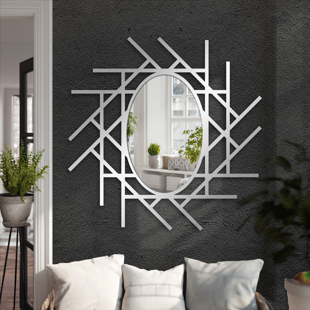 Warm color temperature radiates from the reflection in this abstract linear grid oval floor mirror, a stunning piece of metal decoration wall art.