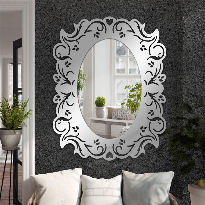 Textured gray walls serve as a striking backdrop for this romantic oval mirror, enhancing its floral frame with the contrast only great modern mirror can provide.