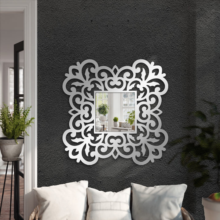 High color contrast is achieved with an ornate floral scroll metal artwork frame on this square stained glass wall mirror.