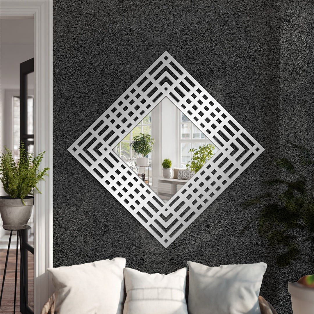 Shifting from the textured dark gray wall to the silver layered grid of this diamond frame floor mirror creates a visually striking example of decorative metal art.