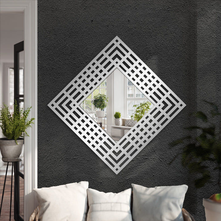 Shifting from the textured dark gray wall to the silver layered grid of this diamond frame floor mirror creates a visually striking example of decorative metal art.