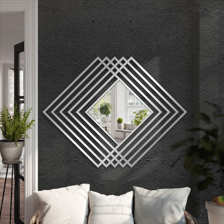 Brightest light reflects off the central square mirror for wall decor in this layered diamond frame floor mirror with modern geometric metal accents.