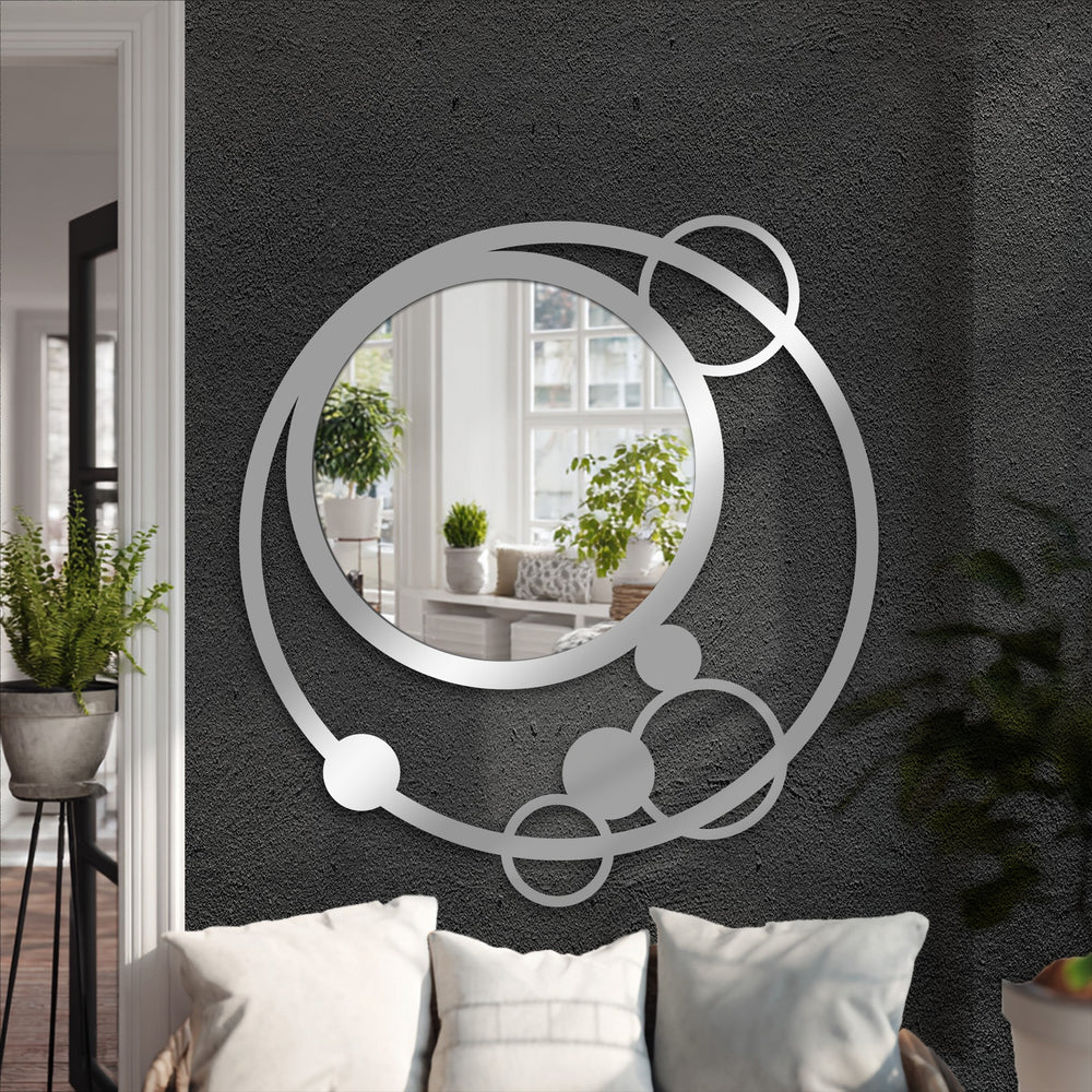 Silver finish on a contemporary, layered circle design elevates this orbit circle floor mirror, making it a stylish piece of modern mirror decor.