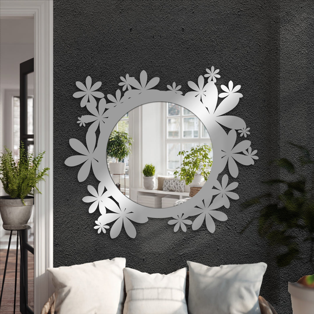 Depth of the reflected room enhances this framed wall mirror, its floral design adding layers and visual interest to the decoration wall art.