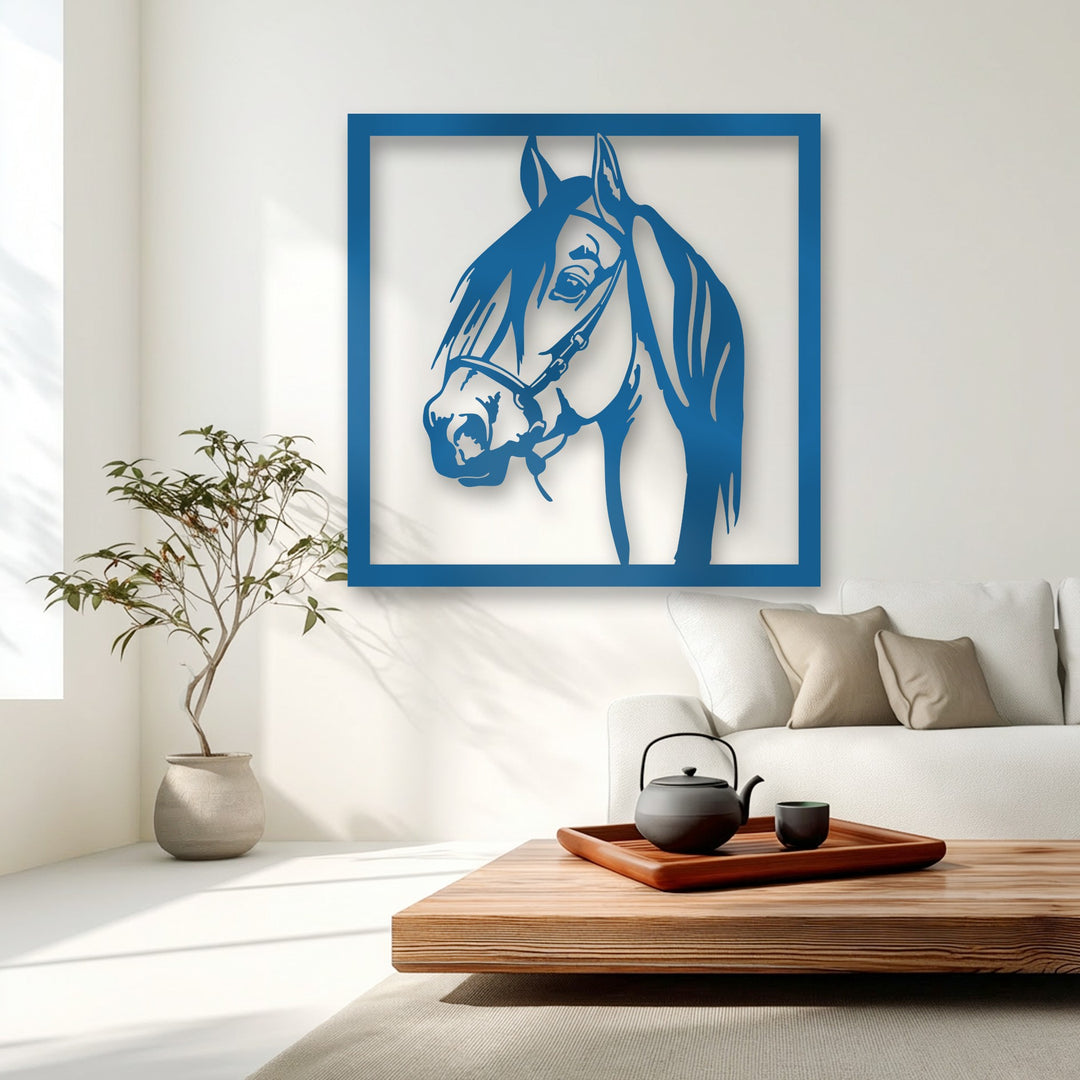 The dimensional blue graceful stallion portrait creates layered shadows, a unique metal wall art piece on a bright white wall.