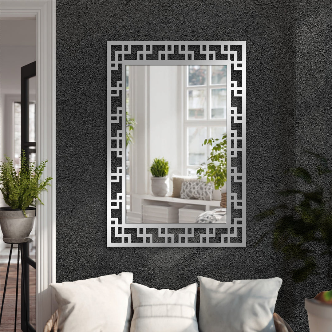Enveloping the geometric maze pattern black metal floor mirror, the darkest area emphasizes the decoration wall art qualities with its textured contrast.