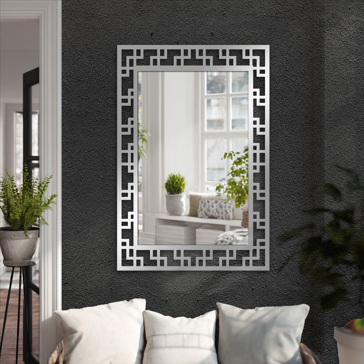 Enveloping the geometric maze pattern black metal floor mirror, the darkest area emphasizes the decoration wall art qualities with its textured contrast.