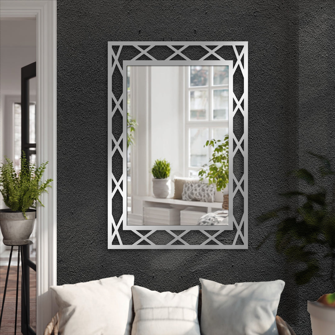 Crisscrossing patterns on the loudest element enhance this modern frame, transforming it into an eye-catching decorative mirror and a piece of metal art for wall.