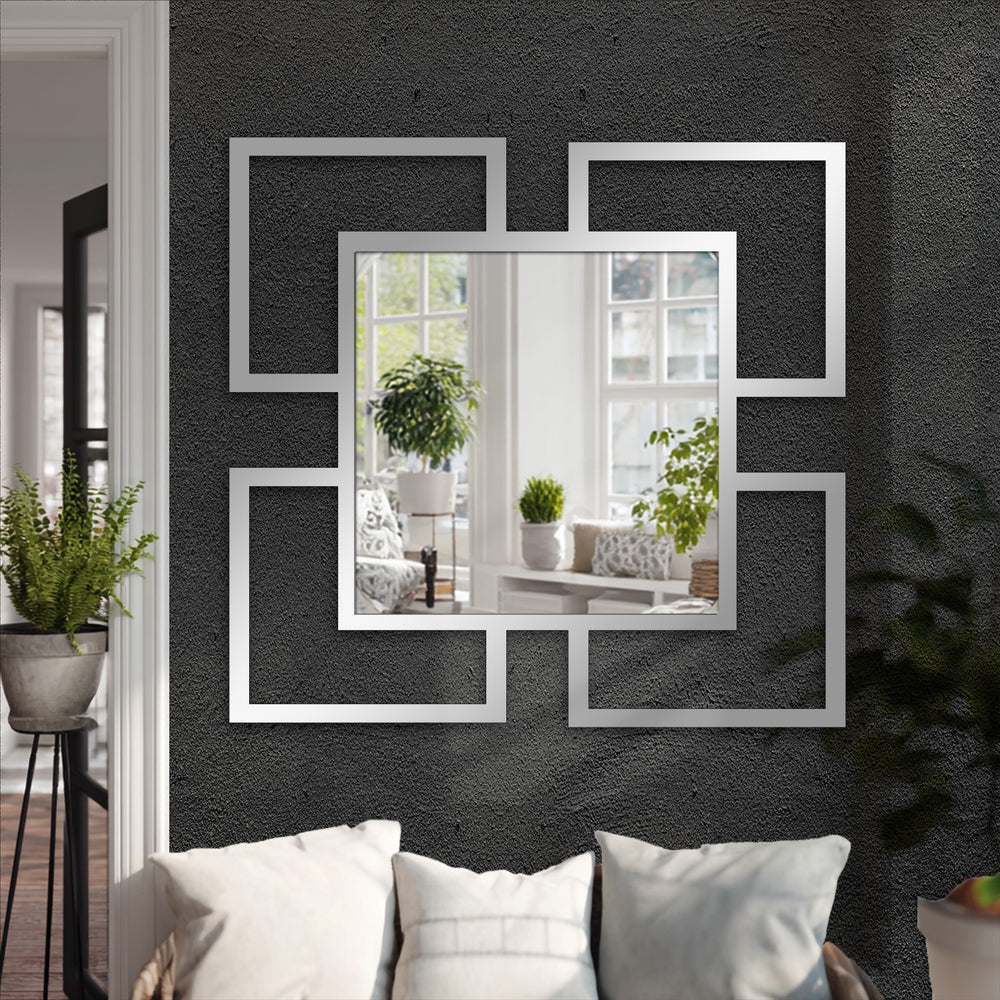 Reflecting shifting hues, this decorative mirror, titled Quadra Flow, captures the subtle transition between interior and exterior colors with its geometric frames.