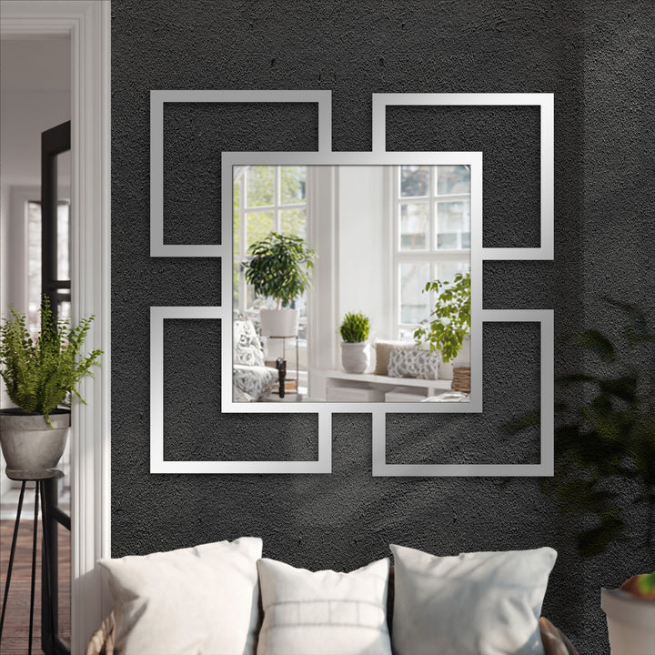 Reflecting shifting hues, this decorative mirror, titled Quadra Flow, captures the subtle transition between interior and exterior colors with its geometric frames.