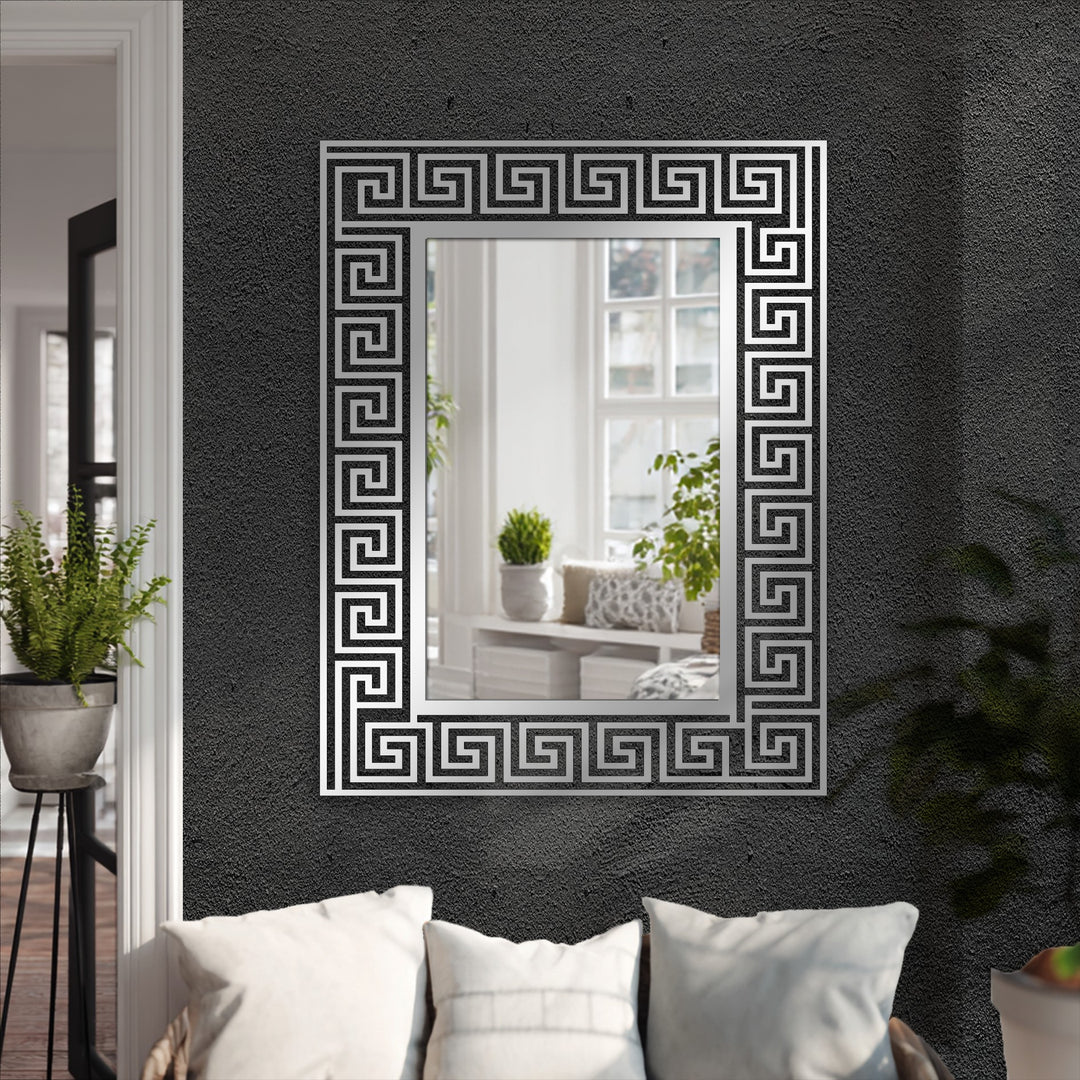 Reflecting a bright interior, the Greek key pattern metal frame around this full-length mirror adds a touch of decoration wall art to the black wall.