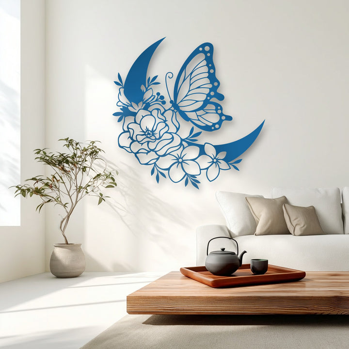 Soft morning light casts intricate shadows of the blue butterfly and floral crescent metal artwork on a pristine white wall, creating a serene atmosphere.