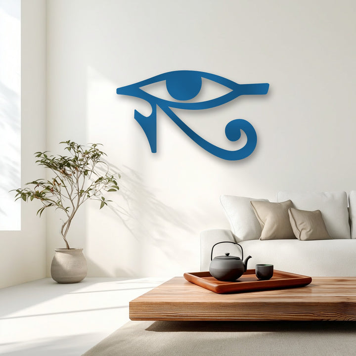 The vibrant blue Eye of Horus metal art for wall sharply contrasts with the pristine white background, highlighting its ancient Egyptian symbol.