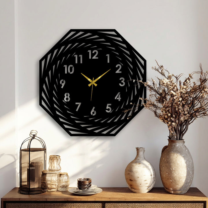 Dramatic light and shadow enhance the modern spiral geometric decoration wall art clock, creating a visually striking contrast with its black metal design.