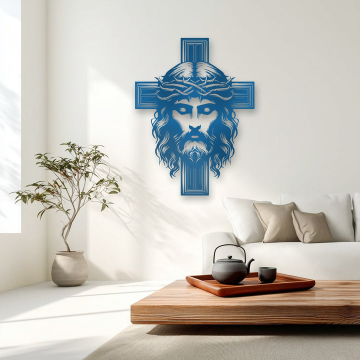 The polished, deep blue surface texture of the Sacred Cross with Christ metal wall decor reveals intricate details and crisp, layered lines.