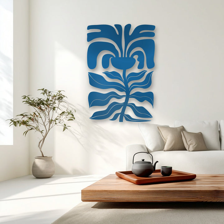The realistic detail of the deep blue abstract floral face metal art for wall enhances the modern minimalist living room ambiance.