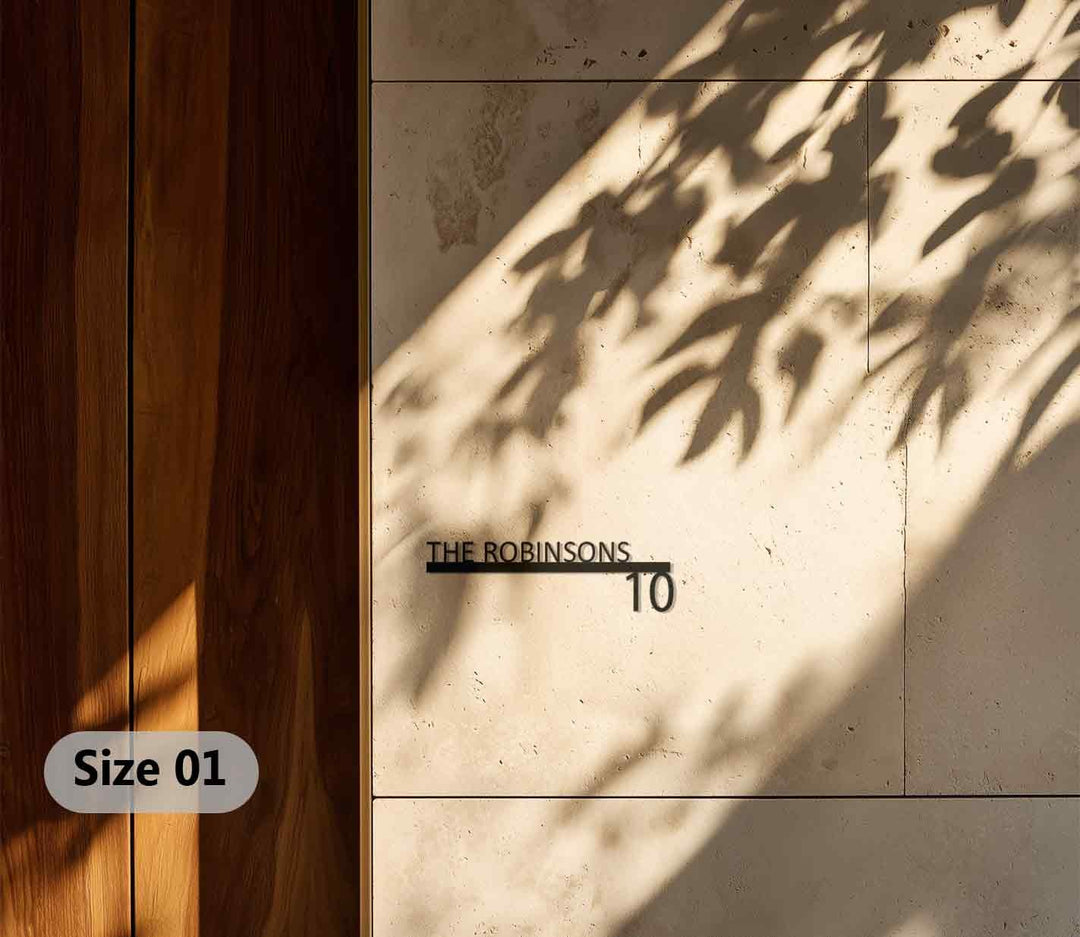 Sleek metal family name sign with number