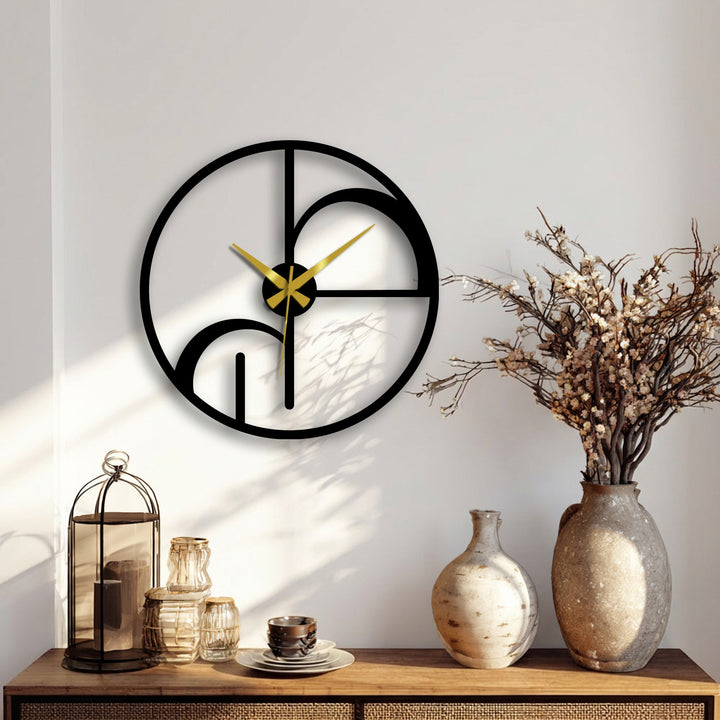 Foreground detail shows a display of neutral-toned vases and decorative items under the abstract geometric metal wall clock, enhancing the decoration wall art.