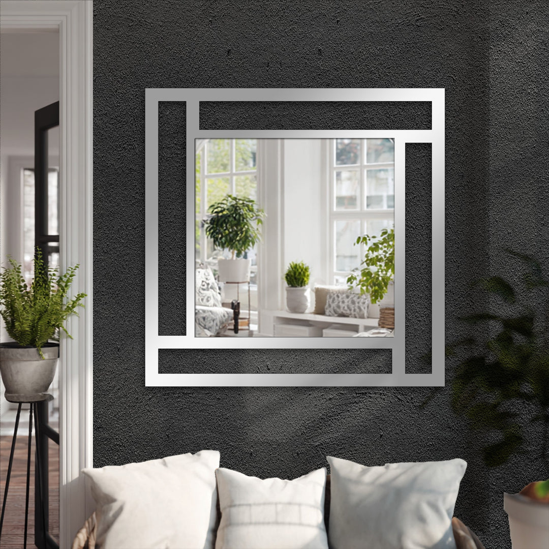 Reflecting a bright living space, the framed geometry square mirror serves as a captivating central subject, exemplifying modern decorating with wall mirrors.