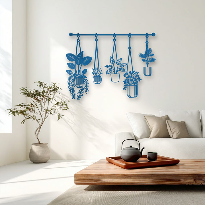 The geometric elements of the deep blue hanging plants metal artwork showcase modern botanical decor.
