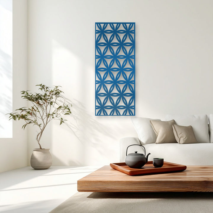 A vibrant blue geometric floral metal art for wall panel displaying a modern repeating pattern in a bright living room.