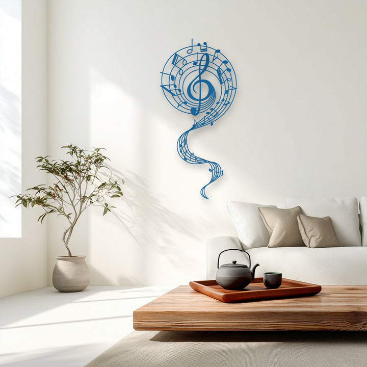 Negative space beautifully frames the graceful blue treble clef and flowing musical notes of the metal artwork.