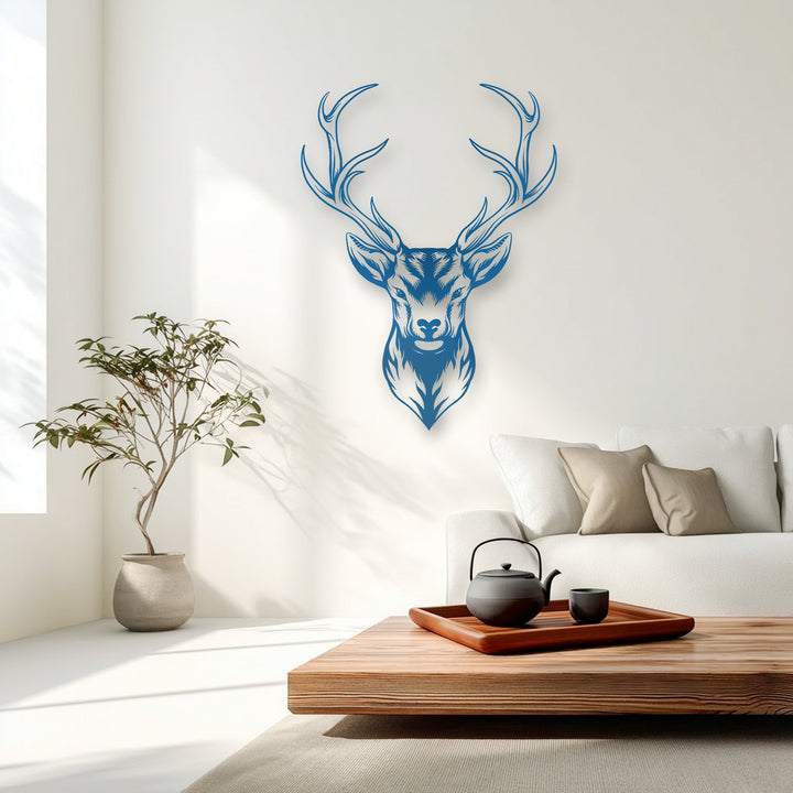 A warm and inviting color temperature permeates this minimalist room featuring a blue majestic deer head metal decoration wall art with detailed antlers.