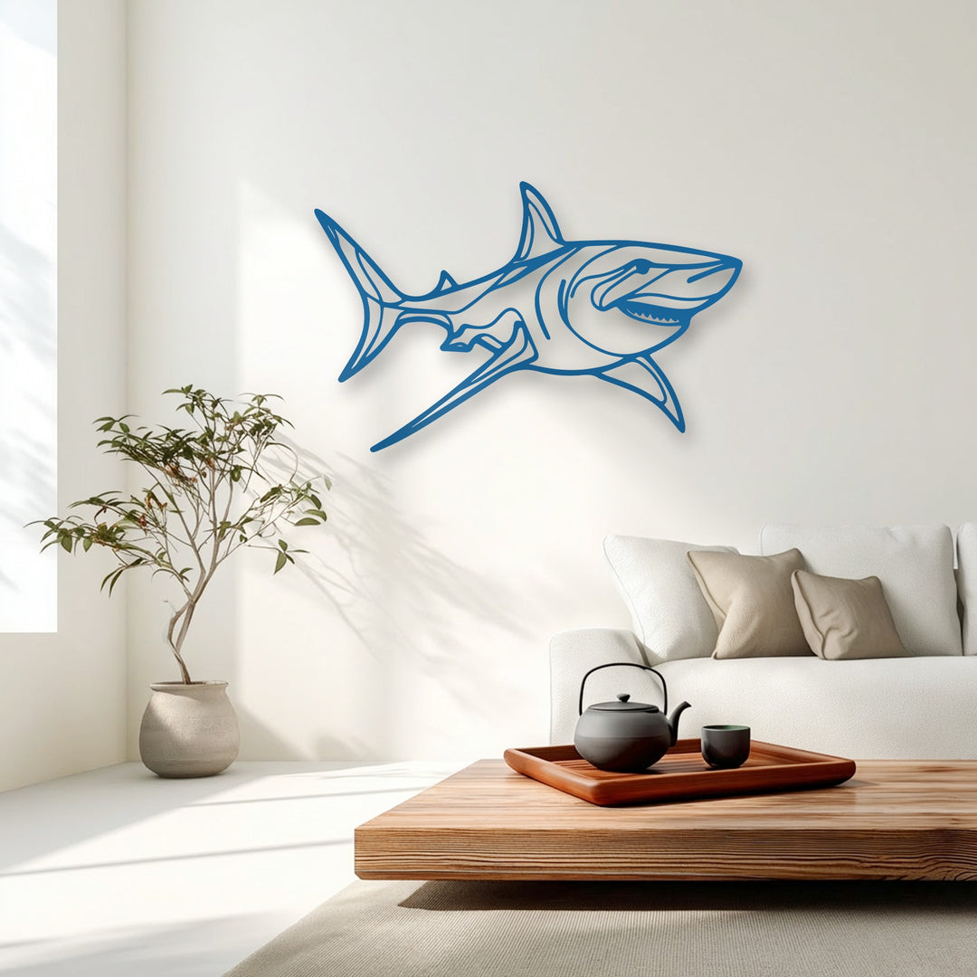 The stillness of the minimalist room highlights the intricate blue shark metal wall decor, depicting a powerful ocean predator.