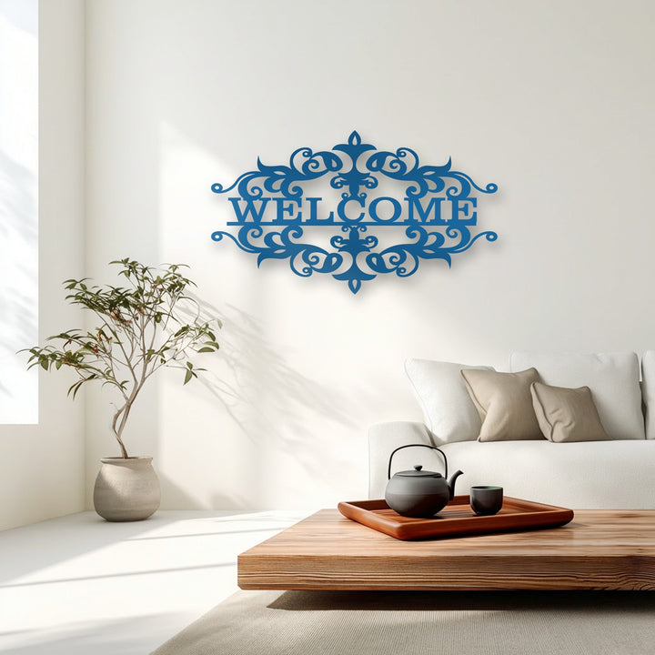 Showcasing superior material quality, this unique metal wall art presents an intricately cut, vibrant blue ornate welcome design.