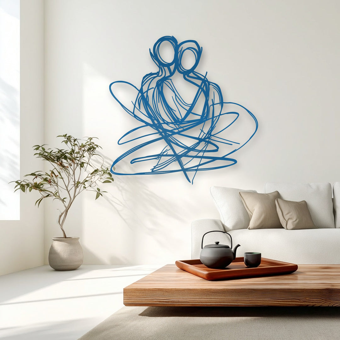 A serene and loving mood is captured by the unique metal wall art depicting an abstract embracing couple in a minimalist living space.