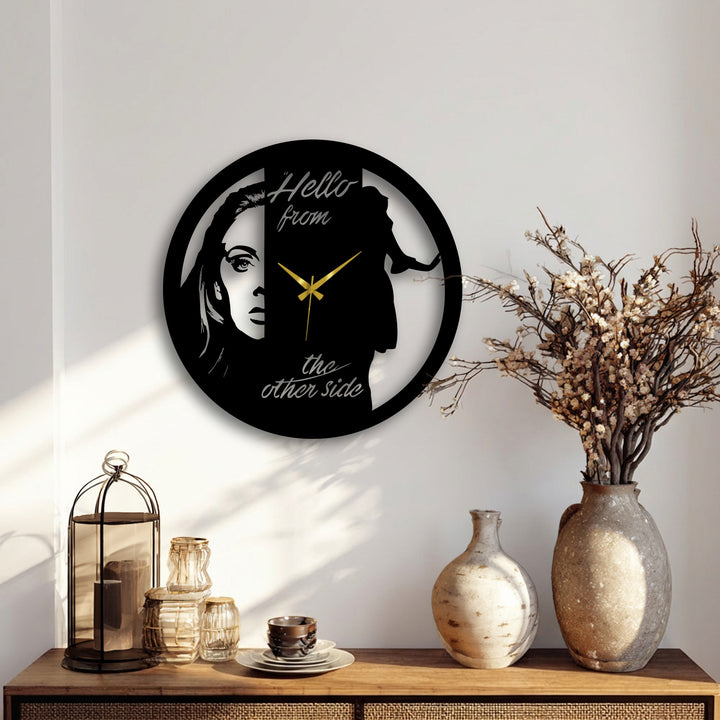 Soft light and shadow highlight the dual face metal wall clock, showcasing its artistic portrait design as a unique piece of decorative metal art.
