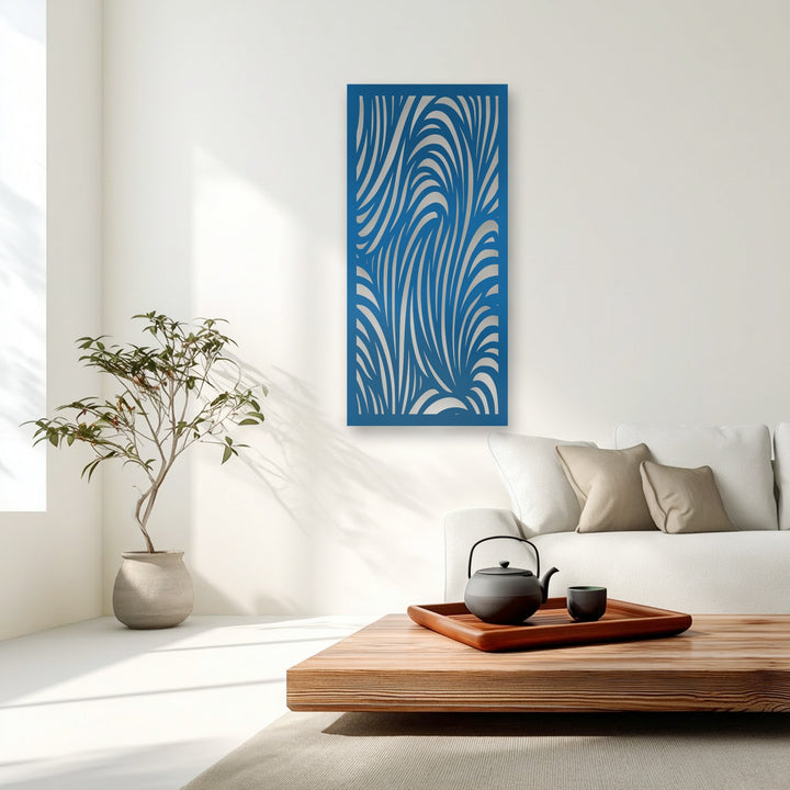 The geometric elements of this decorative metal art reveal an abstract design of flowing silver stripes within a deep blue frame.