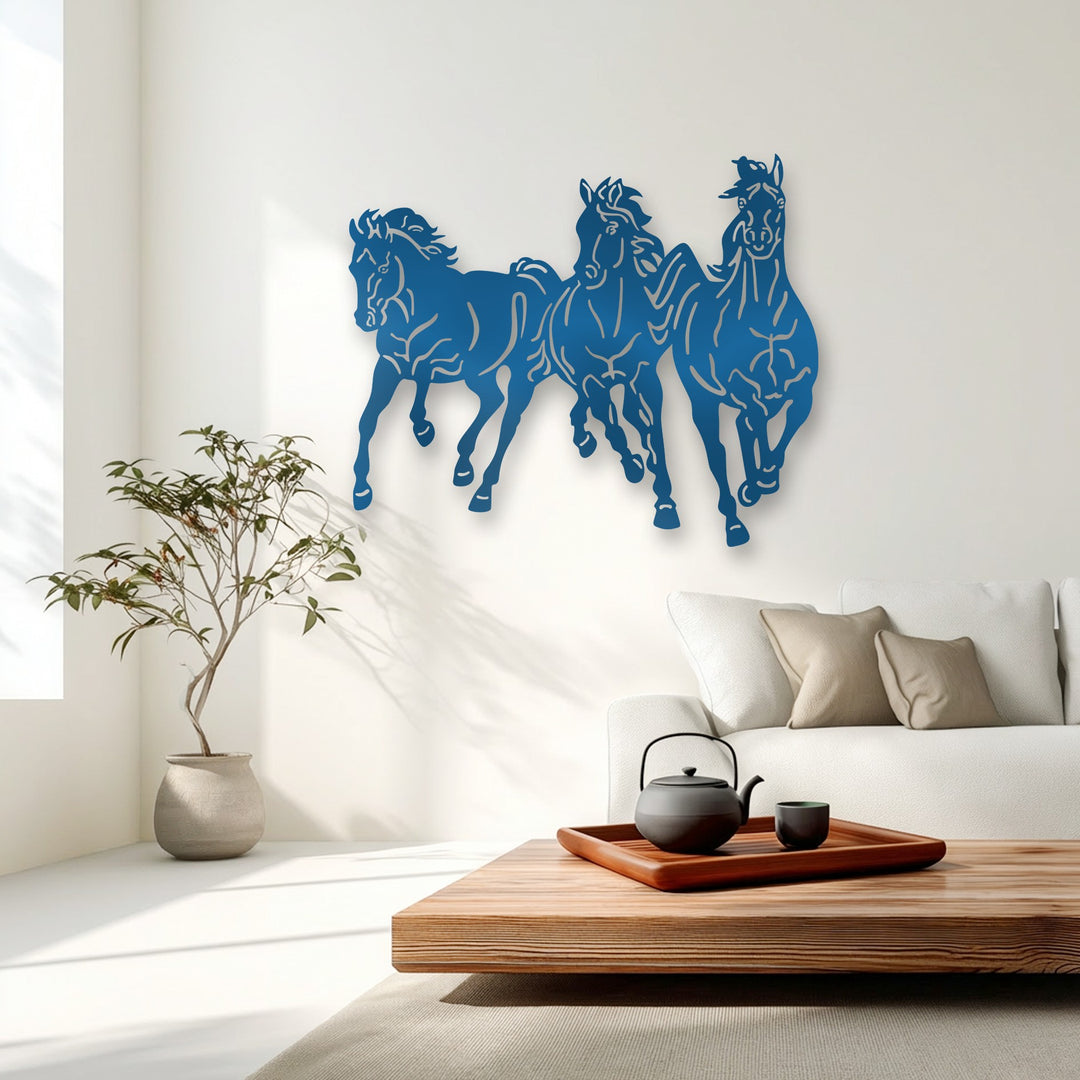 The stark transition from the bold azure of the galloping trio horses metal art for wall to the crisp white wall highlights its dynamic presence.