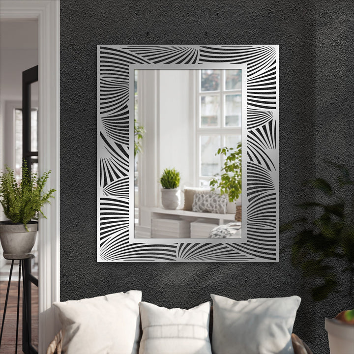 Evoking natural movement, the abstract wave patterns of this framed mirror accentuate the fluidity of organic forms in a modern wall mirrors.