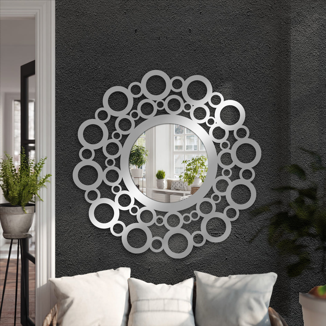 Circular edges with bubble accents define this contemporary modern wall mirrors piece, a metal frame enhancing its artistic, eye-catching design.