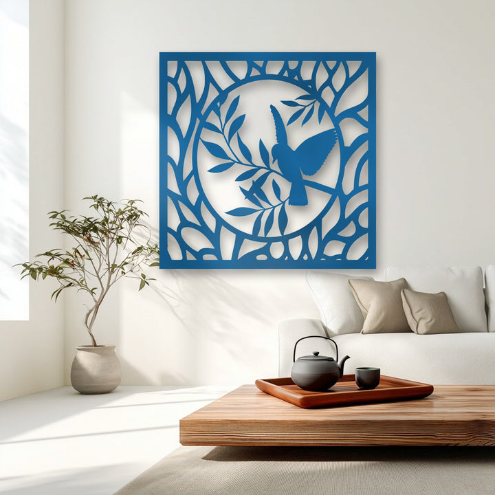 The central focus is an elegant vibrant blue bird and nature circle decorative metal art piece, enhancing the contemporary living room.