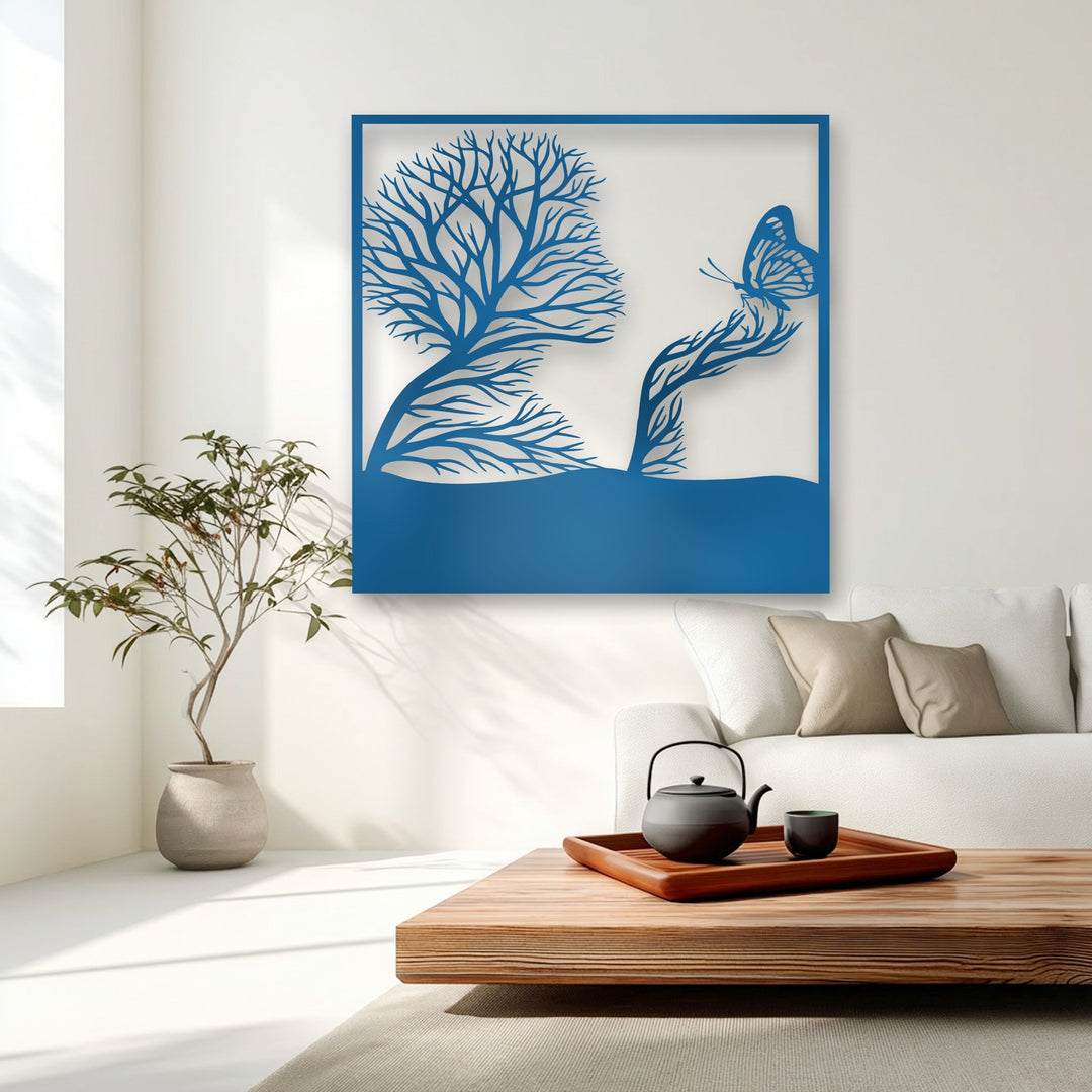 A sunlit, pristine white background beautifully showcases the artistic nature metal art for wall, depicting a whimsical tree and butterfly scene.