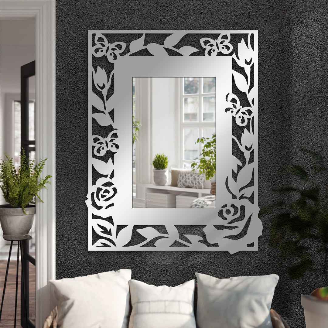 Inviting and sophisticated, this decorative metal art mirror, featuring a floral butterfly frame, creates an elegant and nature-inspired mood for any stylish living space.