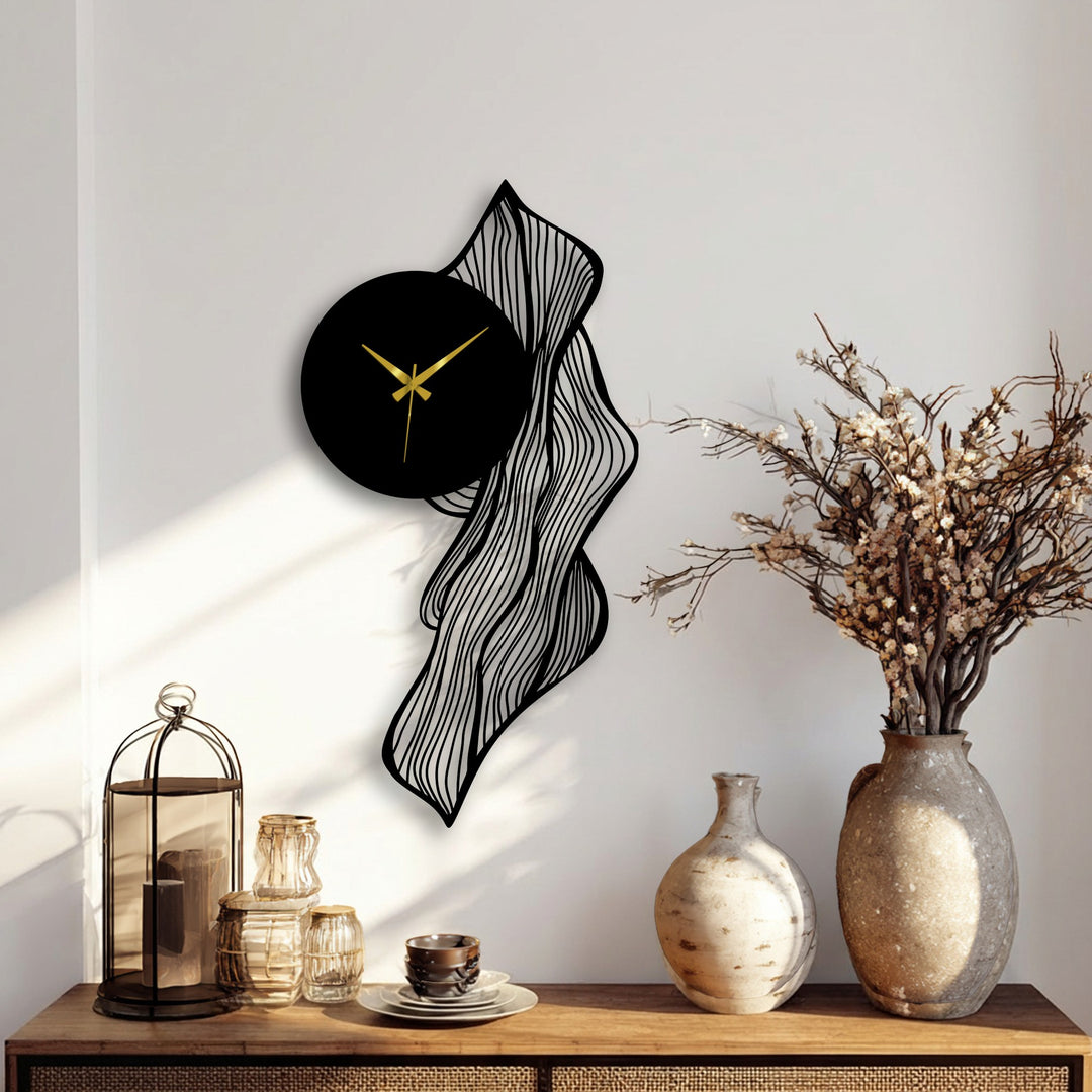 The darkest area highlights the dramatic contrast within this flowing abstract leaf metal art for wall clock, a modern artistic decor piece against a neutral backdrop.